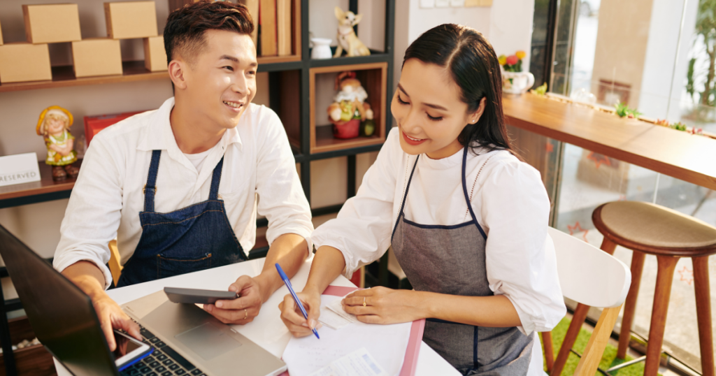 Business partners discussing unsecured loans for bad credit in a modern workspace, focusing on financial solutions.