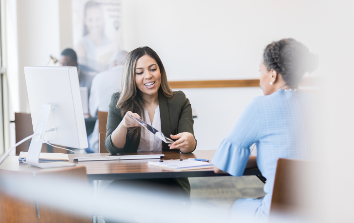 Business loan consultation with a lender, discussing application steps and financing options for small businesses.