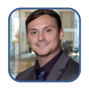 Professional portrait of a man in a suit, representing business support for women entrepreneurs and small business success.