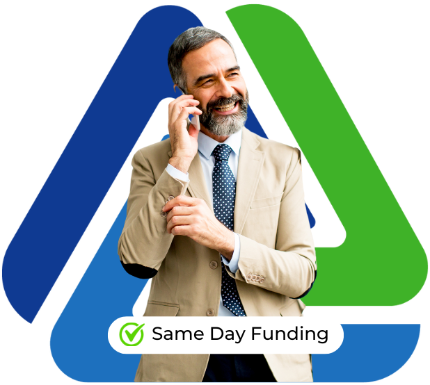 Business professional smiling on the phone, promoting same day funding for business loans.