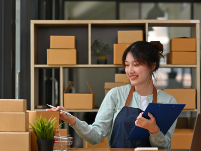 Business owner managing inventory and finances in a Florida shop, exploring bad credit loan options for growth.