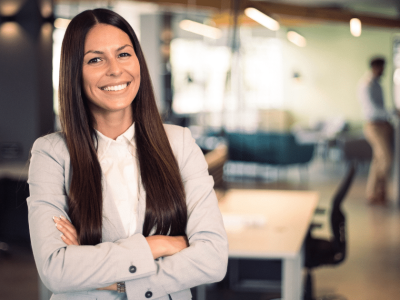 Professional woman smiling in a modern office, representing branding and business growth with Advance Funds Network.