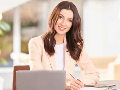 Professional woman in a business setting, exploring tailored loan strategies for business expansion and growth.