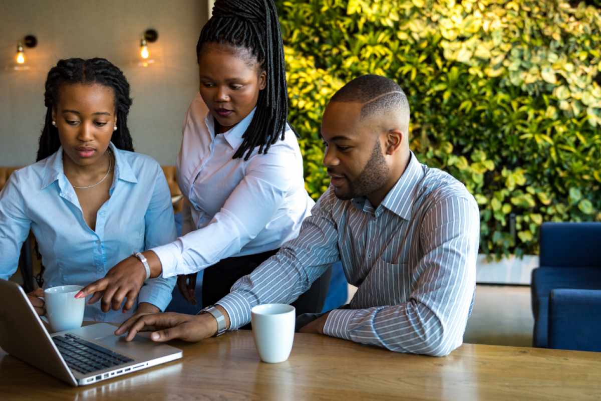 Business partners discussing unsecured loans for bad credit in a modern workspace, focusing on financial solutions.