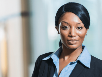 Professional woman in business attire, representing proven methods to attract new customers and enhance business growth.