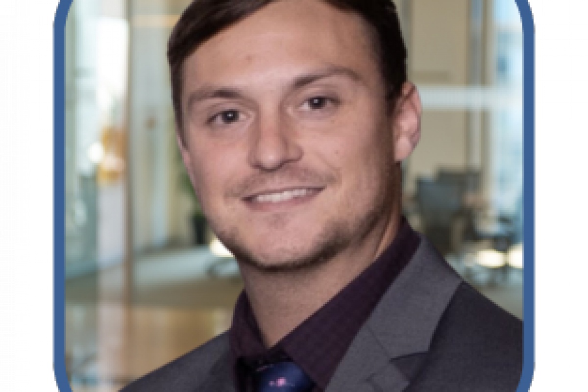 Professional portrait of a man in a suit, representing business support for women entrepreneurs and small business success.