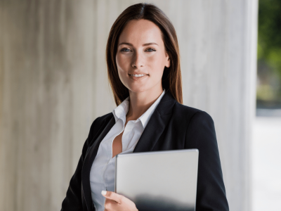 Businesswoman holding a tablet, representing factoring options and financial solutions for small businesses.