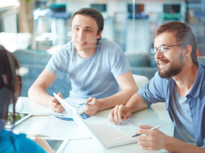 Business professionals discussing financing options for small businesses, comparing AFN Loans and PayPal Working Capital.