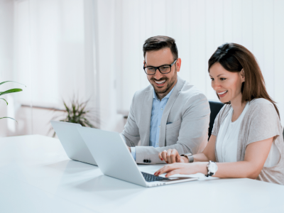 Business professionals collaborating on YouTube strategies for small business growth and success in a modern office setting.