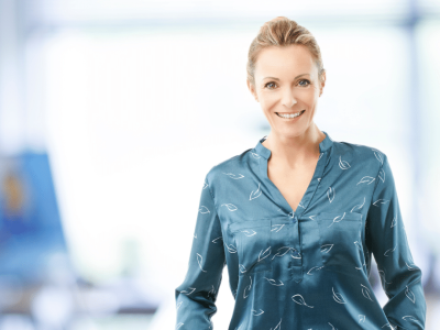 Professional woman in a safe office environment, promoting workplace safety and employee productivity.