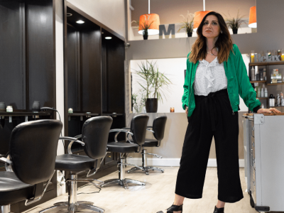 Business owner in a salon showcasing potential for growth with AFN line of credit for financing opportunities.