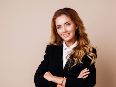 Professional woman smiling in a business suit, representing eCommerce payment gateway solutions for online stores.
