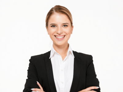 Smiling businesswoman in a suit, representing success strategies for small business growth and customer relationships.