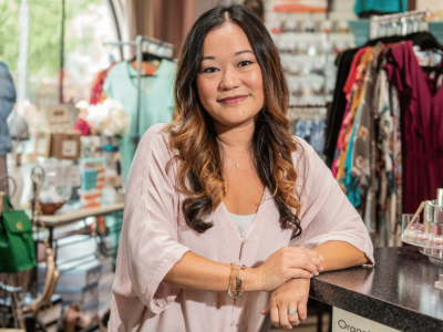 Business owner in a retail store promoting unsecured line of credit benefits for maximizing ROI.