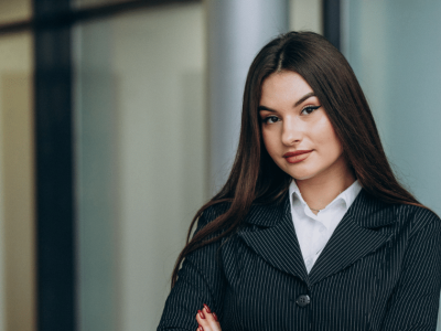 Business professional in a pinstripe suit, representing effective summer sales strategies and customer engagement.