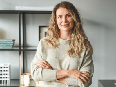 Woman entrepreneur in a cozy office setting, representing small business growth and funding solutions.