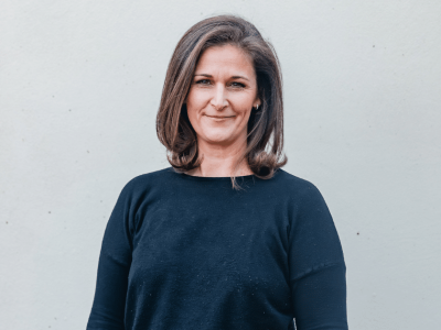 Businesswoman promoting the importance of credit cards for small business success and financial growth.