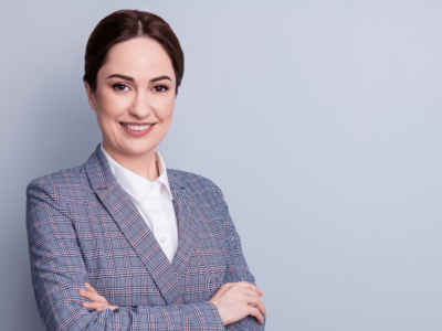 Professional woman smiling, representing effective employee training strategies for small businesses.