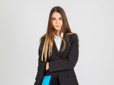 Professional woman in a suit holding a blue folder, representing customer engagement strategies in business.