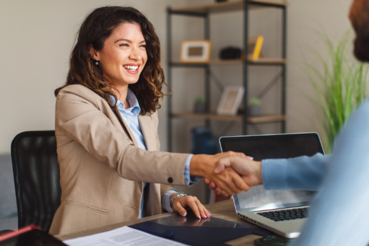 Business professional shaking hands, symbolizing partnership and funding solutions at Advance Funds Network.