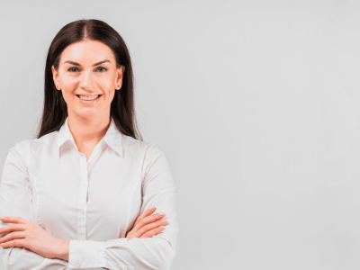 Professional woman smiling, representing customer loyalty strategies and business success in a modern setting.