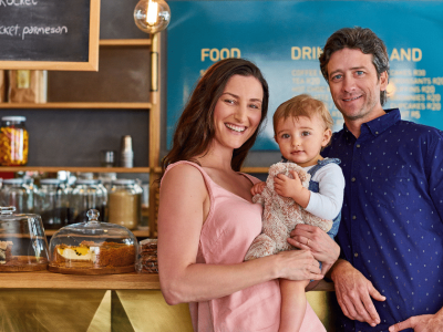 Family-owned cafe showcasing small business success, highlighting the importance of small business loans for growth.