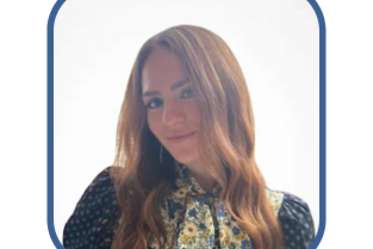 Professional woman with long hair in a floral blouse, representing business empowerment and financial solutions.