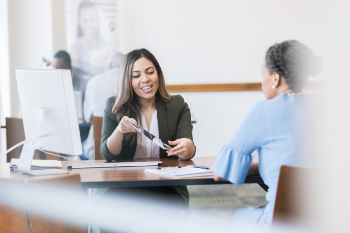 Business loan consultation with a lender, discussing application steps and financing options for small businesses.