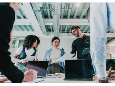 Team collaborating on HR automation strategies, highlighting the importance of efficient HR processes for small business success.